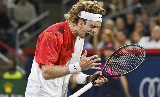 Andrey Rublev, of Russia, reacts after a shot to Alexei Popyrin, of Australia, during the final of the National Bank Open men's tennis tournament in Montreal, Monday, Aug. 12, 2024. (Graham Hughes/The Canadian Press via AP)