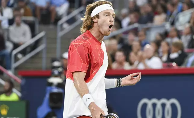 Andrey Rublev, of Russia, reacts after a shot to Alexei Popyrin, of Australia, during the final of the National Bank Open men's tennis tournament in Montreal, Monday, Aug. 12, 2024. (Graham Hughes/The Canadian Press via AP)