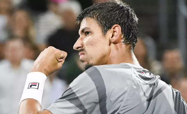 Alexei Popyrin, of Australia, reacts following a shot to Andrey Rublev, of Russia, during the final of the National Bank Open men's tennis tournament in Montreal, Monday, Aug. 12, 2024. (Graham Hughes/The Canadian Press via AP)