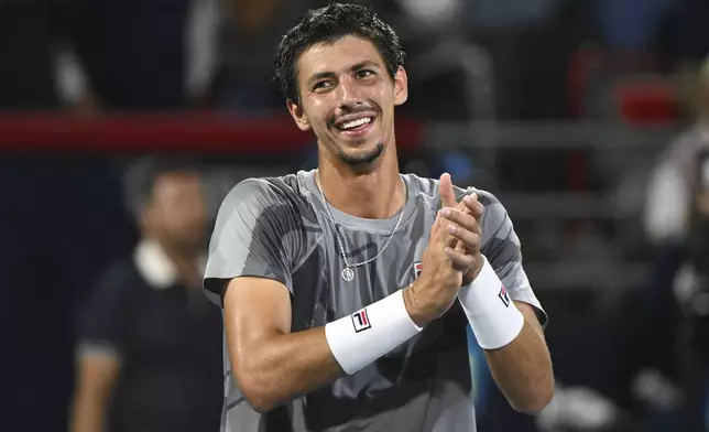 Alexei Popyrin, of Australia, reacts after defeating Andrey Rublev, of Russia, in the final of the National Bank Open men's tennis tournament in Montreal, Monday, Aug. 12, 2024. (Graham Hughes/The Canadian Press via AP)