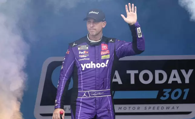 FILE - Denny Hamlin is introduced before a NASCAR Cup Series race, Sunday, June 23, 2024, at New Hampshire Motor Speedway, in Loudon, N.H. (AP Photo/Steven Senne, File)