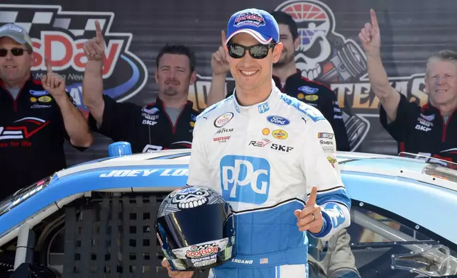 FILE - Joey Logan poses with the pole award in victory lane after earning the position for the NASCAR Xfinity Series auto race at Texas Motor Speedway in Fort Worth, Texas, Saturday, April 8, 2017. (AP Photo/Larry Papke, File)