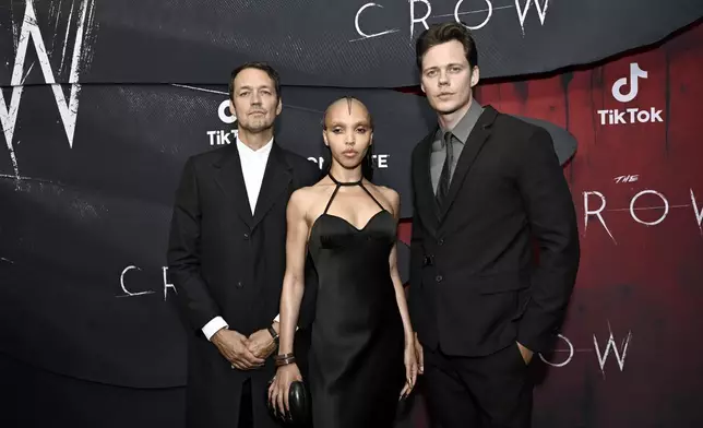 Rupert Sanders, from left, FKA twigs, and Bill Skarsgard attend "The Crow" world premiere at the Village East by Angelika on Tuesday, Aug. 20, 2024, in New York. (Photo by Evan Agostini/Invision/AP)