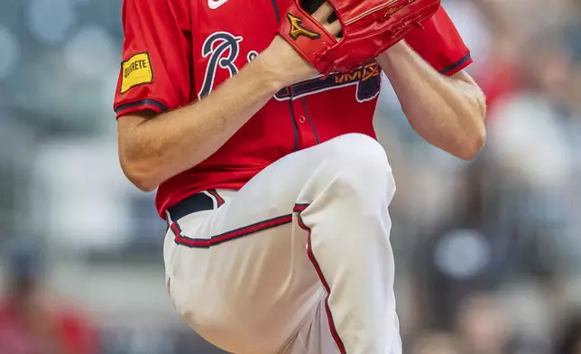 Atlanta Braves pitcher Chris Sale winds up in the first inning of a baseball game against the Washington Nationals, Friday, Aug. 23, 2024, in Atlanta. (AP Photo/Jason Allen)