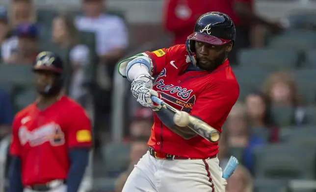 Atlanta Braves' Michael Harris II hits a line drive to center field in the third inning of a baseball game against the Washington Nationals, Friday, Aug. 23, 2024, in Atlanta. (AP Photo/Jason Allen)