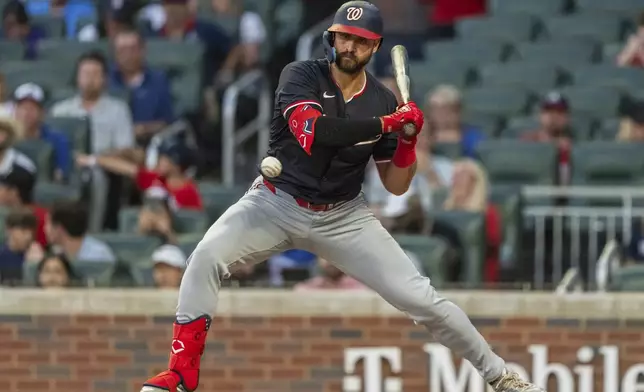 Washington Nationals' Joey Gallo watches a pitch go by called strike in the fourth inning of a baseball game against the Atlanta Braves, Friday, Aug. 23, 2024, in Atlanta. (AP Photo/Jason Allen)