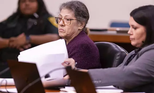 Susan Lorincz, left, listens to testimony during her trial Wednesday, Aug. 14, 2024 in Judge Robert Hodges' courtroom in Ocala, Fla. as her Defense Attorney Amanda Sizemore also listens. (Doug Engle/Ocala Star-Banner via AP)