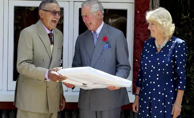 FILE - New Zealand Maori King, Kiingi Tuheitia, from left, reacts with Prince Charles, Prince of Wales, and Camilla, Duchess of Cornwall, at Turangawaewae Marae, Hamilton, New Zealand, Nov. 8, 2015. (David Rowland/Pool Photo via the AP, File)