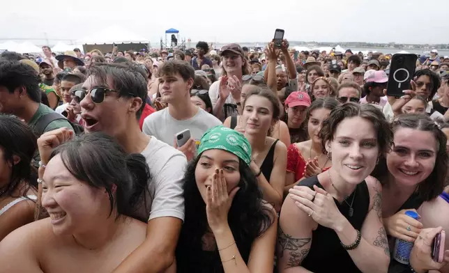 People in the audience cheer during a performance by Laufey at the Newport Jazz Festival, Sunday, Aug. 4, 2024, in Newport, R.I. (AP Photo/Steven Senne)