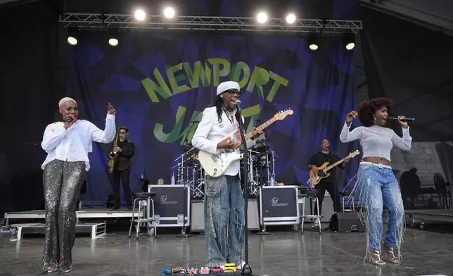 Nile Rodgers, center, and Chic perform during the Newport Jazz Festival, Sunday, Aug. 4, 2024, in Newport, R.I. (AP Photo/Steven Senne)