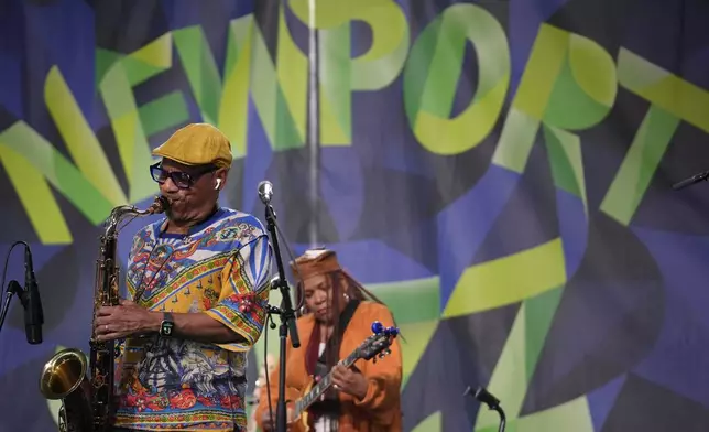 Saxophonist Kirk Whalum, left, performs during the Newport Jazz Festival, Sunday, Aug. 4, 2024, in Newport, R.I. (AP Photo/Steven Senne)