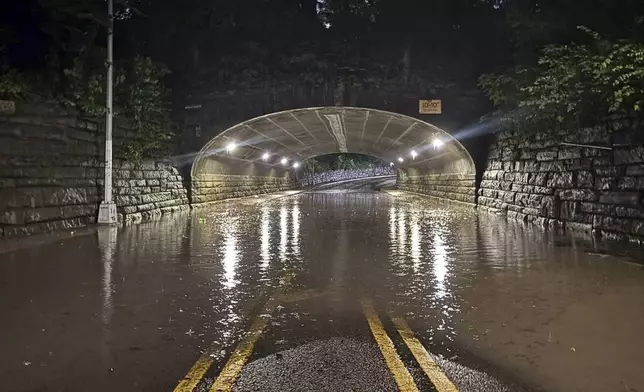 This photo provided by the Central Park Precinct of the New York City Police Department, Aug. 18, 2024, shows the flooded 86th Street transverse road through New York's Central Park. (New York City Police Department via AP)