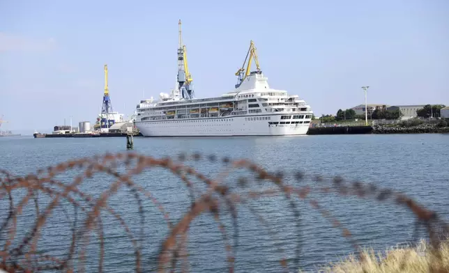 The Odyssey, a US cruise liner operated by Villa Vie Residences docked at Harland &amp; Wolf ship repair facility in Belfast Harbour, Northern Ireland, Friday, Aug. 30, 2024. (AP Photo/Peter Morrison)