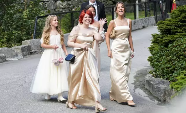 The daughters of Norway's Princess Martha Louise, Maud Angelica Behn, Emma Tallulah Behn and Leah Isadora Behn, in Geiranger, Norway, Saturday Aug. 31, 2024, during the wedding of Princess Martha Louise and Durek Verrett. (Cornelius Poppe/NTB via AP)