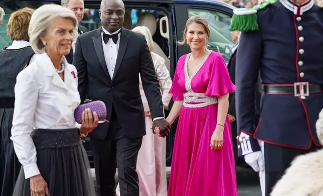 FILE - Norway's Princess Martha Louise and her fiance Durek Verrett arrive at the government's party event in connection with Princess Ingrid Alexandra's 18th birthday, which is held at Deichman Bjoervika, Oslo's main library, Thursday June 16, 2022. (Hakon Mosvold Larsen/NTB via AP, File)