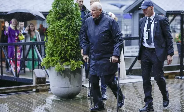 Norway's King Harald arrives for a theme party at Hotel Union in Geiranger, Norway, Friday evening, Aug. 30, 2024, the evening before the wedding ceremony of Princess Märtha Louise and Derek Verrett. (Cornelius Poppe/NTB Scanpix via AP)