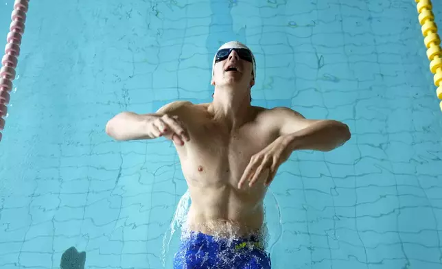 David Kratochvil, a teenage swimmer who prepares for the Paralympic Games in Paris, trains in Tachov, Czech Republic, Wednesday, July 3, 2024. (AP Photo/Petr David Josek)