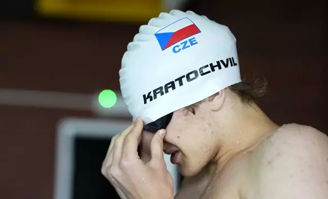 David Kratochvil, a teenage swimmer who prepares for the Paralympic Games in Paris, gets ready for his training in Tachov, Czech Republic, Wednesday, July 3, 2024. (AP Photo/Petr David Josek)