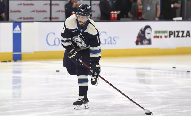 FILE - Columbus Blue Jackets forward Johnny Gaudreau warms up before an NHL hockey game against the Pittsburgh Penguins in Columbus, Ohio, Saturday, March 30, 2024. (AP Photo/Paul Vernon, File)