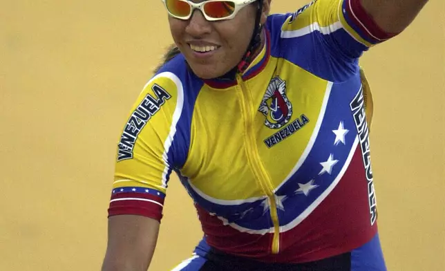 FILE - Venezuela's Daniela Larreal celebrates her gold medal victory during the Central American and Caribbean Games in San Salvador, El Salvador on Friday, Nov. 29, 2002. (AP Photo/Moises Castillo, File)