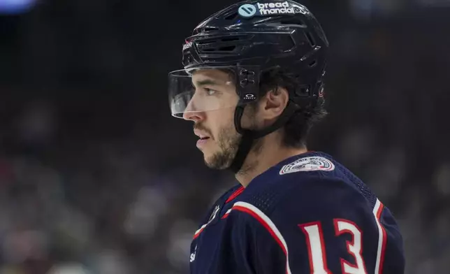 FILE - Columbus Blue Jackets' Johnny Gaudreau (13) awaits the face-off during an NHL hockey game against the Nashville Predators, March 9, 2024, in Columbus, Ohio. (AP Photo/Aaron Doster, File)