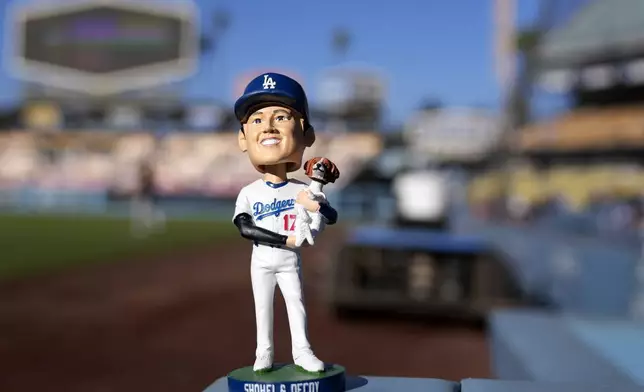 The bobblehead for Los Angeles Dodgers designated hitter Shohei Ohtani is seen prior to a baseball game between the Dodgers and the Baltimore Orioles Thursday, Aug. 29, 2024, in Los Angeles. (AP Photo/Mark J. Terrill)