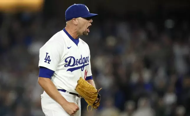 Los Angeles Dodgers relief pitcher Blake Treinen reacts after striking out Baltimore Orioles' Gunnar Henderson to end the top of the seventh inning with the bases loaded in a baseball game Thursday, Aug. 29, 2024, in Los Angeles. (AP Photo/Mark J. Terrill)