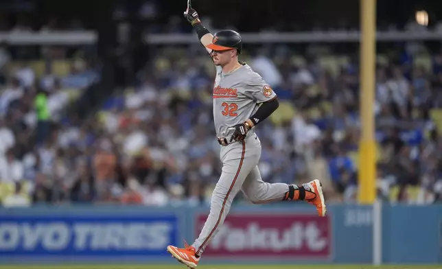 Baltimore Orioles' Ryan O'Hearn celebrates as he rounds the bases after a solo home run during the second inning of a baseball game against the Los Angeles Dodgers, Tuesday, Aug. 27, 2024, in Los Angeles. (AP Photo/Marcio Jose Sanchez)