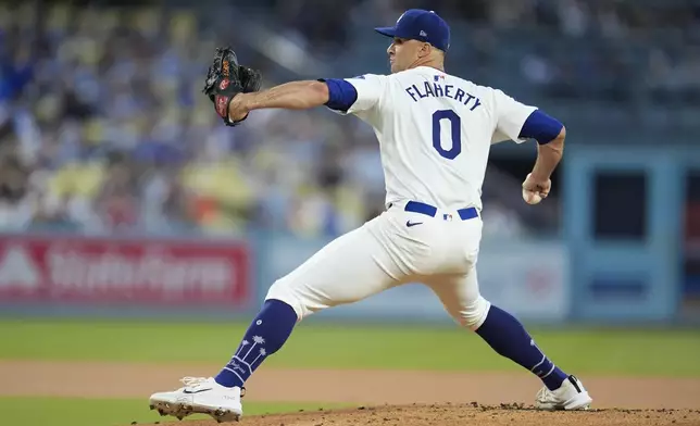 Los Angeles Dodgers starting pitcher Jack Flaherty throws to a Baltimore Orioles batter during the first inning of a baseball game, Tuesday, Aug. 27, 2024, in Los Angeles. (AP Photo/Marcio Jose Sanchez)