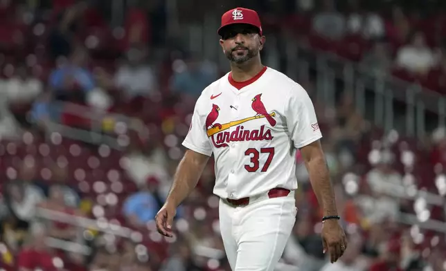 St. Louis Cardinals manager Oliver Marmol walks back from the mound after making a pitching change during the seventh inning of a baseball game against the San Diego Padres Tuesday, Aug. 27, 2024, in St. Louis. (AP Photo/Jeff Roberson)