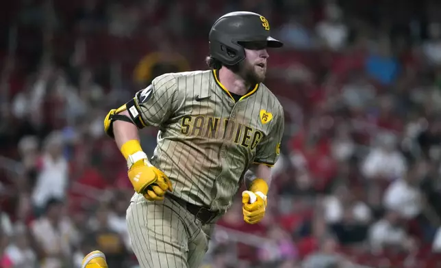 San Diego Padres' Jake Cronenworth heads to first on an RBI single during the seventh inning of a baseball game against the St. Louis Cardinals Tuesday, Aug. 27, 2024, in St. Louis. (AP Photo/Jeff Roberson)