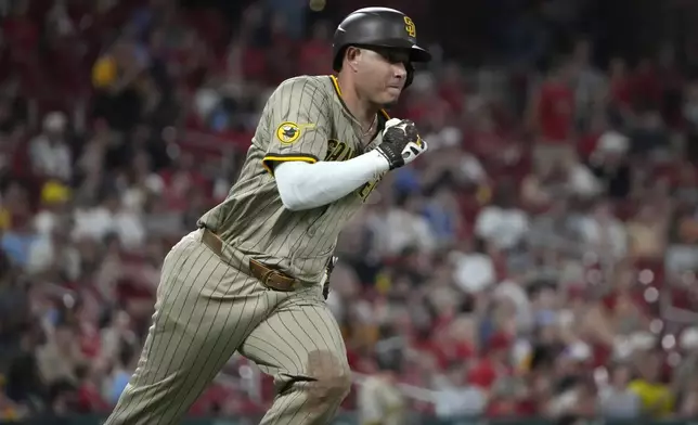 San Diego Padres' Manny Machado rounds first on his way to an RBI double during the fifth inning of a baseball game against the St. Louis Cardinals Monday, Aug. 26, 2024, in St. Louis. (AP Photo/Jeff Roberson)