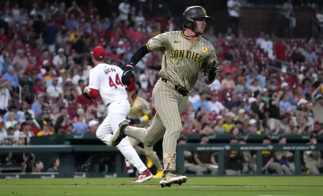 San Diego Padres' Jackson Merrill, right, heads to first on a two-run single off St. Louis Cardinals starting pitcher Kyle Gibson (44) during the third inning of a baseball game Monday, Aug. 26, 2024, in St. Louis. (AP Photo/Jeff Roberson)