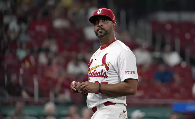 St. Louis Cardinals manager Oliver Marmol walks back from the mound after making a pitching change during the seventh inning of a baseball game against the San Diego Padres Tuesday, Aug. 27, 2024, in St. Louis. (AP Photo/Jeff Roberson)