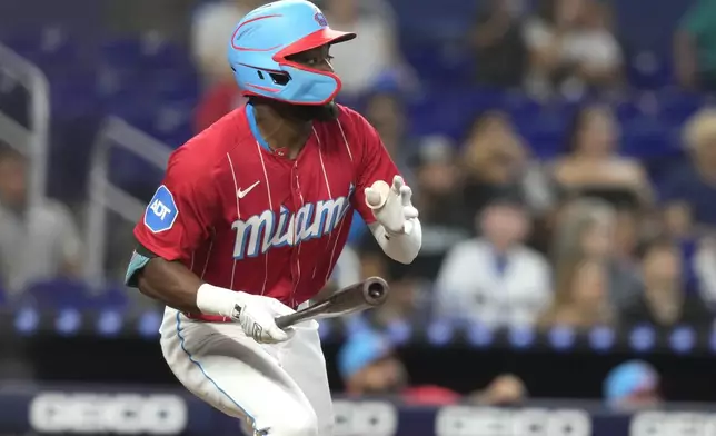 Miami Marlins' Vidal Brujan watches after hitting a solo home run during the fourth inning of a baseball game against the San Diego Padres, Saturday, Aug. 10, 2024, in Miami. (AP Photo/Lynne Sladky)