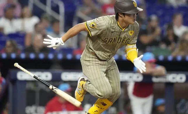 San Diego Padres' Ha-Seong Kim runs after hitting a single to score David Peralta during the fourth inning of a baseball game against the Miami Marlins, Saturday, Aug. 10, 2024, in Miami. (AP Photo/Lynne Sladky)