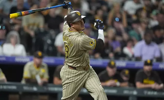 San Diego Padres' Manny Machado grounds out against Colorado Rockies relief pitcher Victor Vodnik to end a baseball game Friday, Aug. 16, 2024, in Denver. (AP Photo/David Zalubowski)