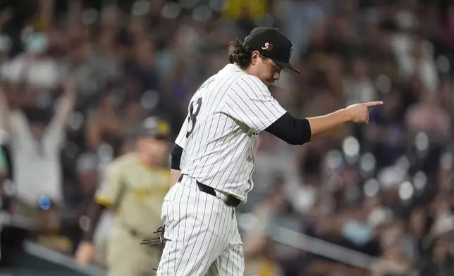 Colorado Rockies relief pitcher Victor Vodnik gestures after getting San Diego Padres' Jurickson Profar to hit into a double play in the ninth inning of a baseball game Friday, Aug. 16, 2024, in Denver. (AP Photo/David Zalubowski)