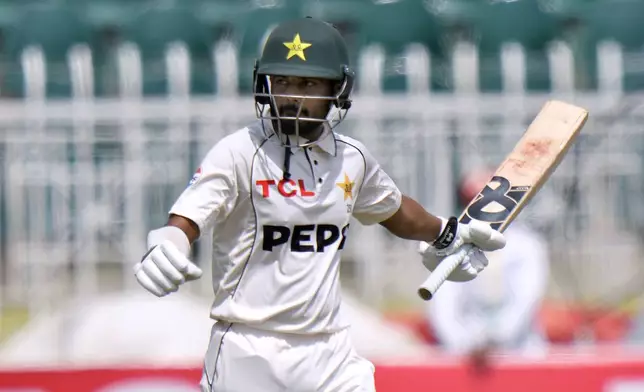 Pakistan's Saud Shakeel celebrates after scoring century during the second day of first cricket test match between Pakistan and Bangladesh, in Rawalpindi, Pakistan, Thursday, Aug. 22, 2024. (AP Photo/Anjum Naveed)