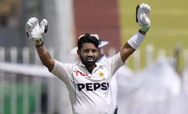 Pakistan's Mohammad Rizwan celebrates after scoring century during the second day of first cricket test match between Pakistan and Bangladesh, in Rawalpindi, Pakistan, Thursday, Aug. 22, 2024. (AP Photo/Anjum Naveed)