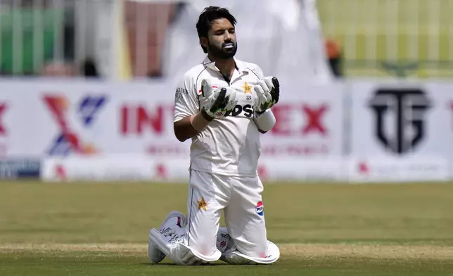 Pakistan's Mohammad Rizwan prays after scoring century during the second day of first cricket test match between Pakistan and Bangladesh, in Rawalpindi, Pakistan, Thursday, Aug. 22, 2024. (AP Photo/Anjum Naveed)