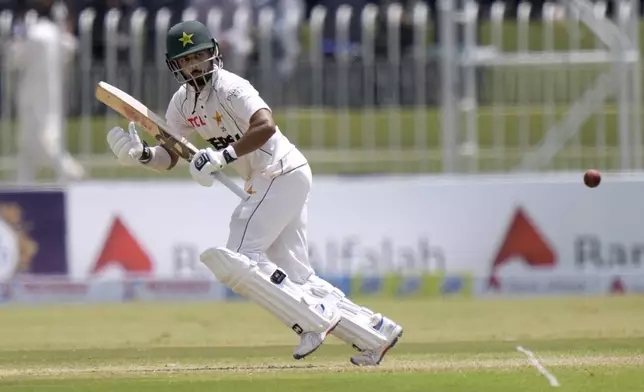 Pakistan's Saud Shakeel plays a shot during the second day of first cricket test match between Pakistan and Bangladesh, in Rawalpindi, Pakistan, Thursday, Aug. 22, 2024. (AP Photo/Anjum Naveed)