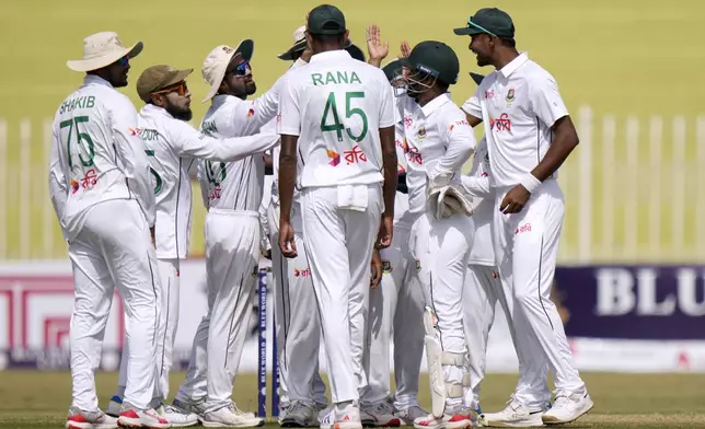 Bangladesh's Litton Das, second right, celebrates with teammates after stump out to Pakistan Saud Shakeel during the second day of first cricket test match between Pakistan and Bangladesh, in Rawalpindi, Pakistan, Thursday, Aug. 22, 2024. (AP Photo/Anjum Naveed)