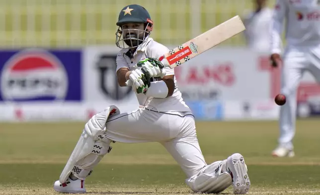 Pakistan's Mohammad Rizwan plays a shot during the second day of first cricket test match between Pakistan and Bangladesh, in Rawalpindi, Pakistan, Thursday, Aug. 22, 2024. (AP Photo/Anjum Naveed)