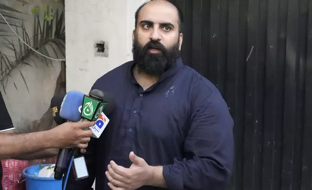 Farhan Asif, a freelance web developer who was charged with spreading misinformation that helped spark widespread rioting in the U.K, talks to the media after his acquittal from court, in Lahore, Pakistan, Monday, Aug. 26, 2024. (AP Photo/K.M. Chaudary)