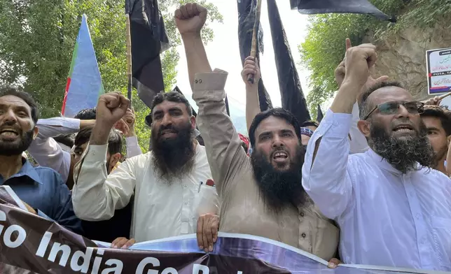 Supporters Pasban-e-Hurriyat Jammu Kashmir, chant slogans during a protest to show solidarity with the Kashmiri people on the eve of the fifth anniversary of India's decision to strip the disputed region of its semi-autonomy, in Muzaffarabad, Pakistan, Monday, Aug. 5, 2024. (AP Photo/M.D. Mughal)