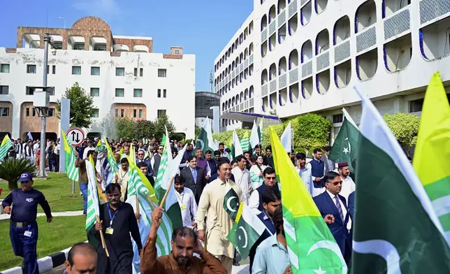 In this handout photo released by the Pakistan Foreign Ministry, Pakistani officials take part in a rally to show solidarity with the Kashmiri people on the eve of the fifth anniversary of India's decision to strip the disputed region of its semi-autonomy, in Islamabad, Pakistan, Monday, Aug. 5, 2024. (Pakistan Foreign Ministry via AP)