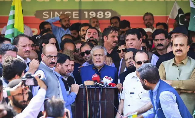 In this handout photo released by the Pakistan Foreign Ministry, Deputy Prime Minister Ishaq Dar, center, addresses a crowd of people to show solidarity with the Kashmiri people on the eve of the fifth anniversary of India's decision to revoke the disputed region's semi-autonomy, in Islamabad, Pakistan, Monday, Aug. 5, 2024. (Pakistan Foreign Ministry via AP)