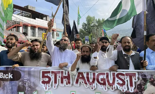 Supporters Pasban-e-Hurriyat Jammu Kashmir, chant slogans during a protest to show solidarity with the Kashmiri people on the eve of the fifth anniversary of India's decision to strip the disputed region of its semi-autonomy, in Muzaffarabad, Pakistan, Monday, Aug. 5, 2024. (AP Photo/M.D. Mughal)