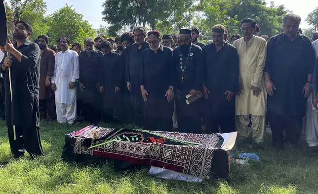 People attend funeral prayer of a Shiite Muslims pilgrim, who was killed in the bus crash in Iran while heading to Iraq for a pilgrimage, in Larkana, Pakistan, Saturday, Aug. 24, 2024. (AP Photo/Muhammad Usama)